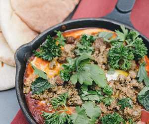 Shakshouka topped with ground lamb