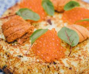 Tortilla topped with uni and roe