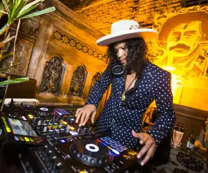 Dani Villareal mixing at the DJ booth