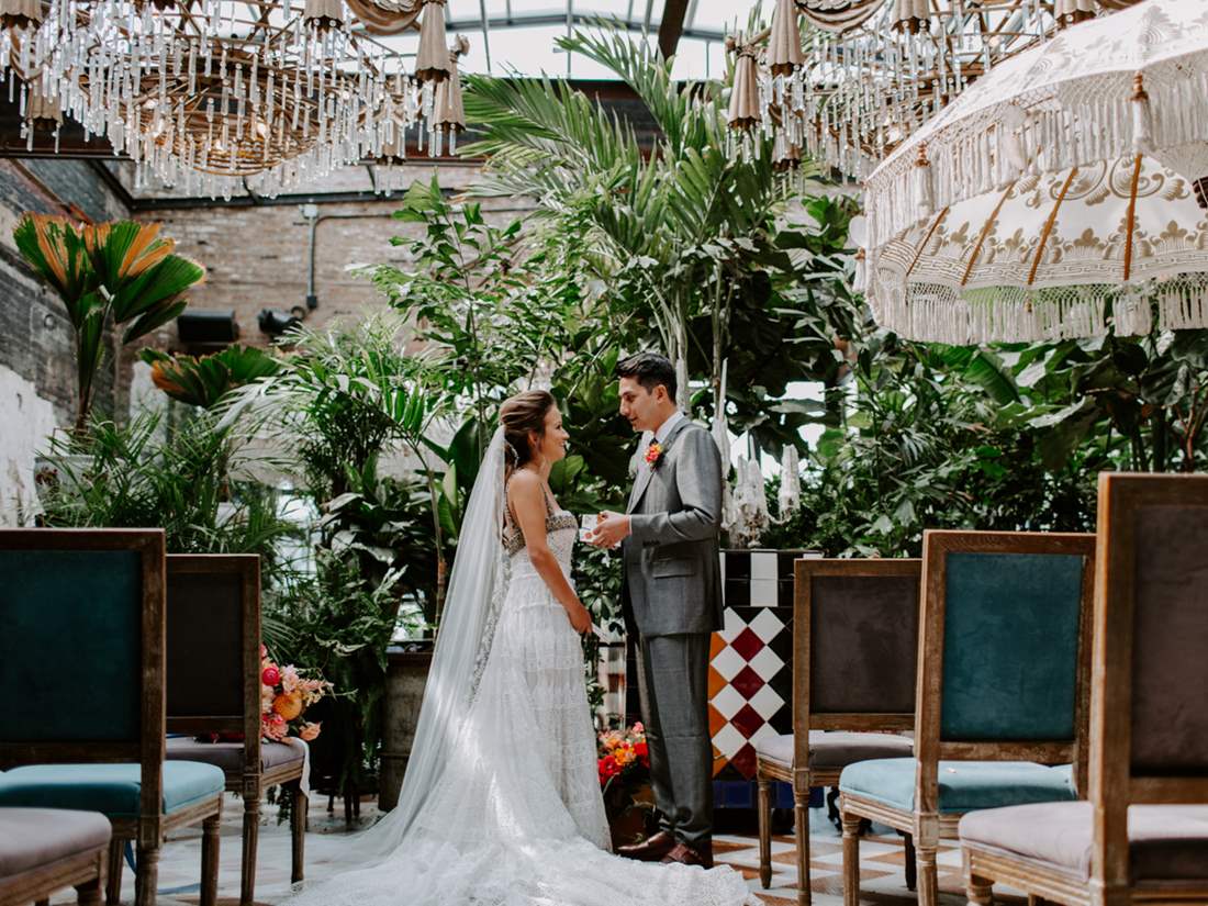 Bride and Groom posed at end of aisle