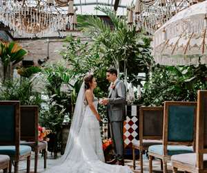 Bride and Groom posed at end of aisle