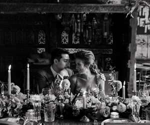 Groom with arms around Bride